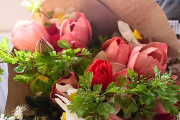 Small seasonal flower bouquet with fresh garden flowers arranged naturally