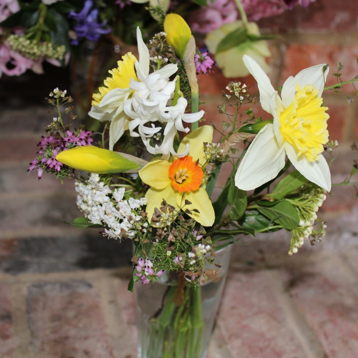 Small jar posie arrangement of locally grown garden flowers